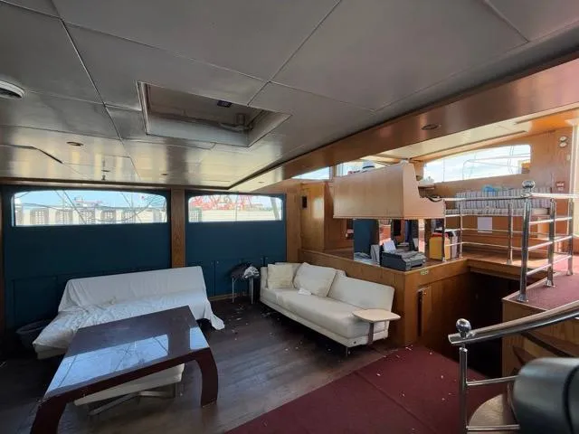 42 M Custom Made Motorsailor Yacht Photos Pics Luxurious interior of 2006 Custom Made 42 M Motorsailor with sofas and wooden accents.