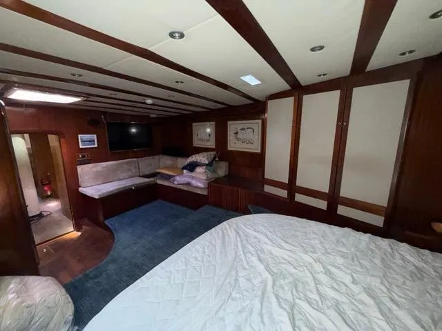 42 M Custom Made Motorsailor Yacht Photos Pics Luxurious interior of 2006 Custom Made 42 M Motorsailor with cozy seating and elegant wood finish.