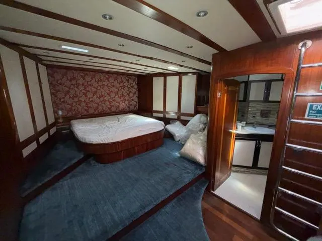 42 M Custom Made Motorsailor Yacht Photos Pics Luxurious interior of 2006 Custom Made 42 M Motorsailor with elegant wood finish and spacious layout.