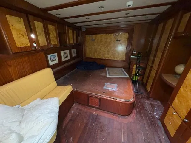 42 M Custom Made Motorsailor Yacht Photos Pics Interior of a 2006 Custom Made 42 M Motorsailor with wood paneling and seating area.