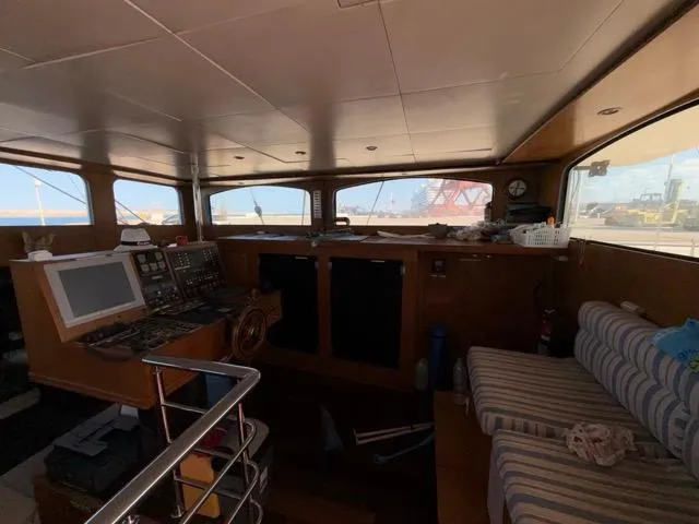 42 M Custom Made Motorsailor Yacht Photos Pics Interior of 2006 Custom Made 42 M Motorsailor with navigation equipment and seating area.