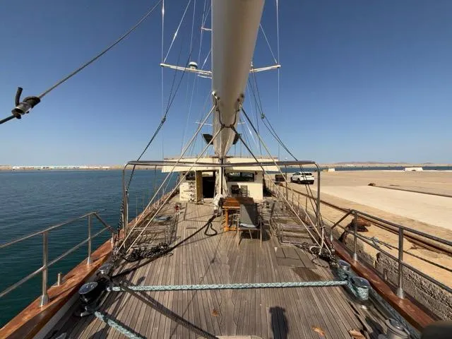 42 M Custom Made Motorsailor Yacht Photos Pics Custom Made 42 M Motorsailor, 2006, docked with wooden deck and clear blue sky.