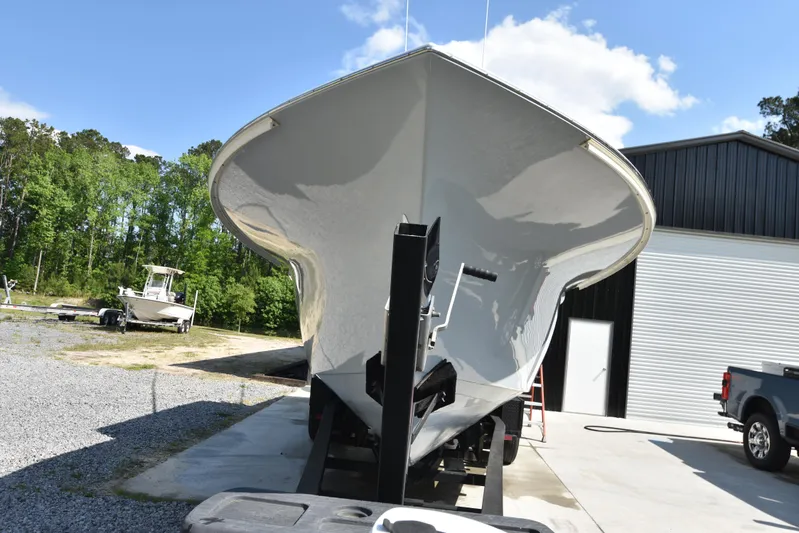 Double Trouble Yacht Photos Pics Custom Carolina 28 Cape Lookout boat, 2007 model, repowered in 2019, on trailer outdoors.