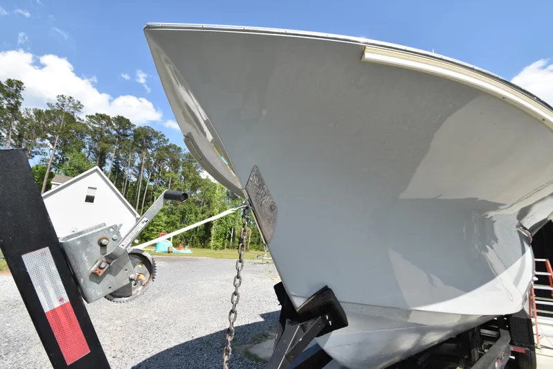 Double Trouble Yacht Photos Pics Custom Carolina 28 Cape Lookout boat on trailer, 2007 model, repowered in 2019, outdoors.