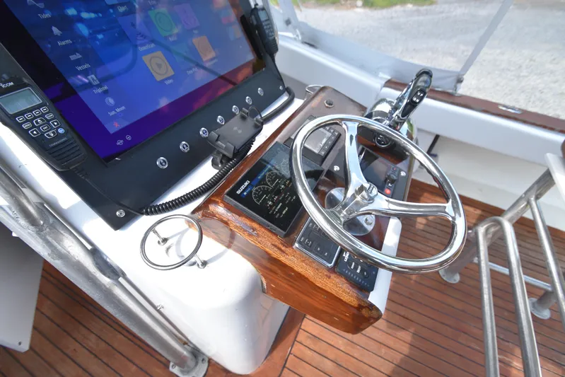 Double Trouble Yacht Photos Pics Helm of 2007 Custom Carolina 28 Cape Lookout boat, featuring modern controls and touchscreen display.