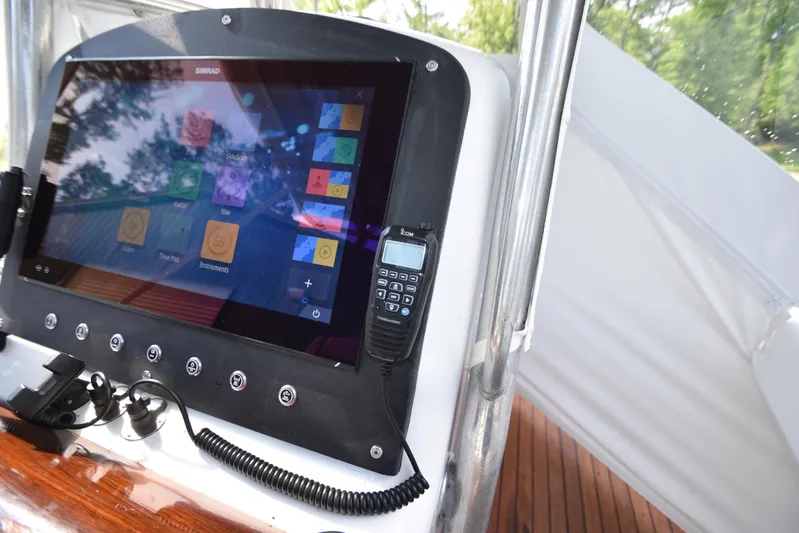 Double Trouble Yacht Photos Pics Control panel of a 2007 Custom Carolina 28 Cape Lookout boat, featuring modern navigation equipment.