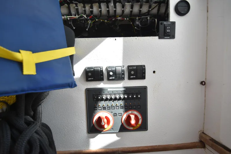 Double Trouble Yacht Photos Pics Control panel of a 2007 Custom Carolina 28 Cape Lookout boat, featuring switches and wiring.