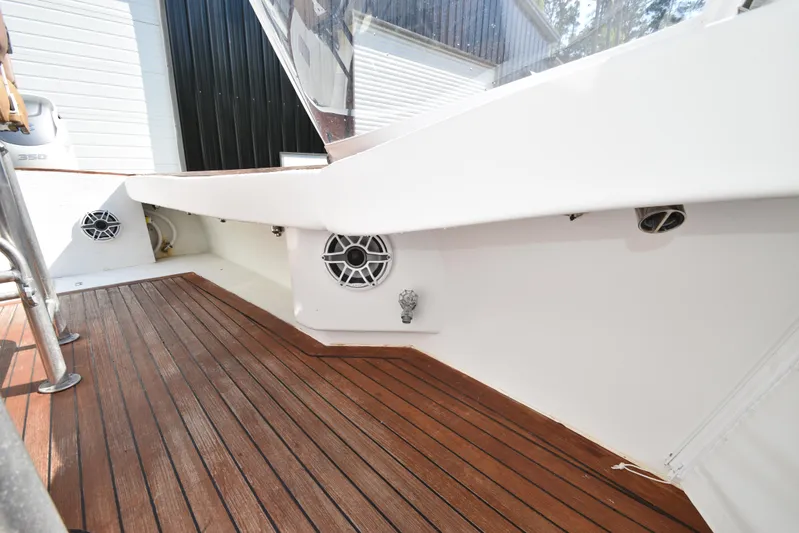 Double Trouble Yacht Photos Pics Custom Carolina 28 Cape Lookout boat deck, 2007 model, featuring wood flooring and speaker system.