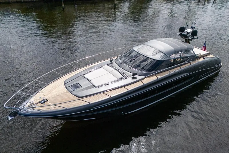  Yacht Photos Pics Luxurious 2015 Riva 63 yacht on calm water, showcasing sleek design and elegance.