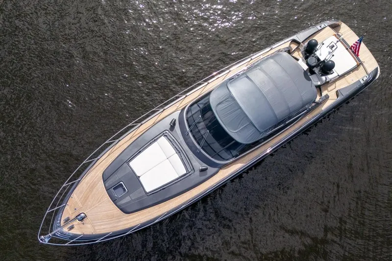  Yacht Photos Pics Overhead view of a 2015 Riva 63 yacht on water, showcasing sleek design and luxury features.