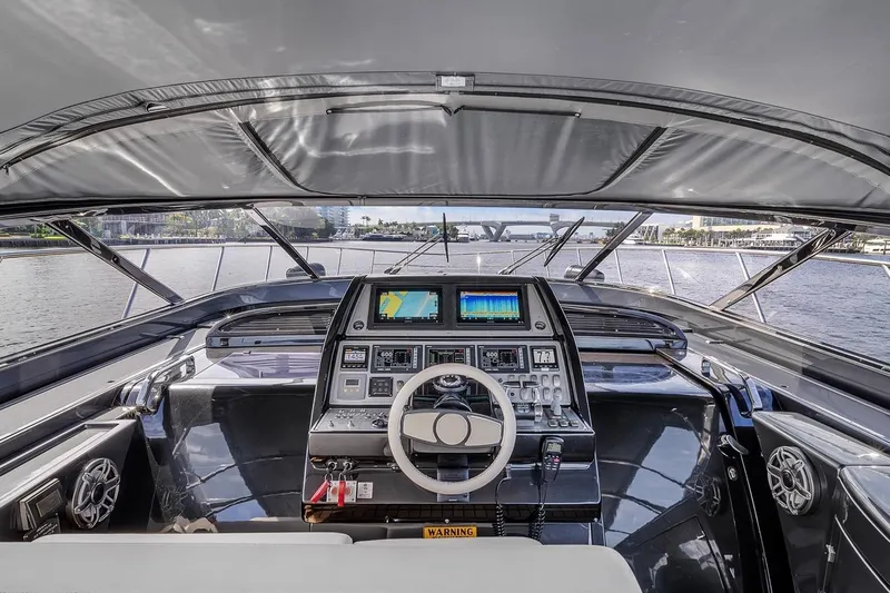  Yacht Photos Pics Cockpit view of a 2015 Riva 63 yacht with advanced navigation controls.