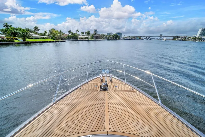  Yacht Photos Pics Bow view of 2015 Riva 63 yacht cruising on a scenic waterway.