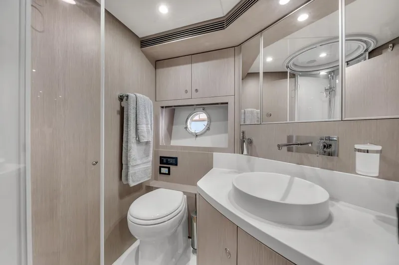  Yacht Photos Pics Luxurious bathroom in 2015 Riva 63 yacht with modern fixtures and elegant design.