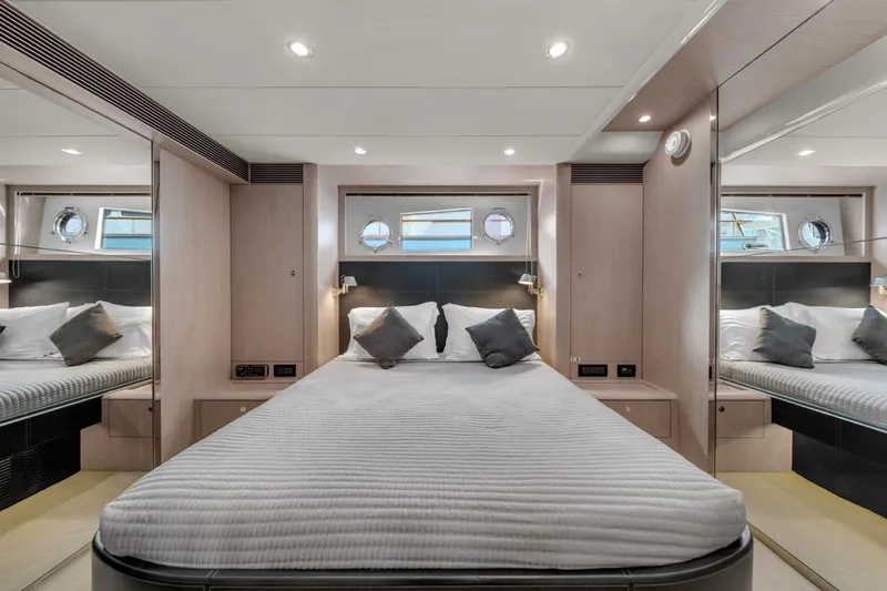  Yacht Photos Pics Luxurious bedroom interior of 2015 Riva 63 yacht with modern design and elegant furnishings.
