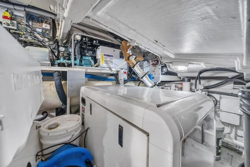  Yacht Photos Pics Engine room of a 2015 Riva 63 yacht, showcasing machinery and equipment.