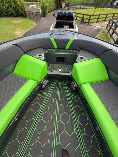  Yacht Photos Pics 2020 Midnight Express Open 43 boat interior with vibrant green and black seating and flooring.