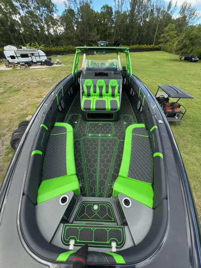  Yacht Photos Pics 2020 Midnight Express Open 43 boat with vibrant green and black interior design.