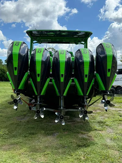  Yacht Photos Pics Five green and black outboard motors on a 2020 Midnight Express Open 43 boat.