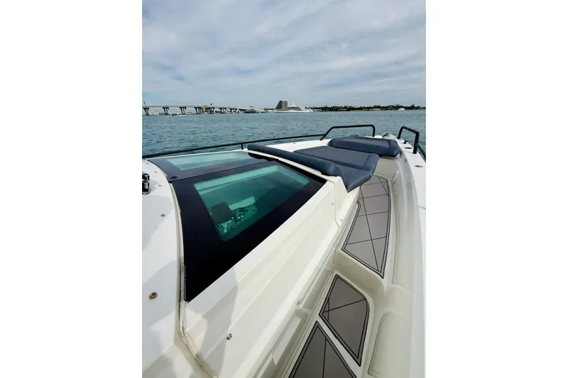 Out Of The Blue Yacht Photos Pics 2021 Axopar 37 Sun Top boat with sleek design on open water.