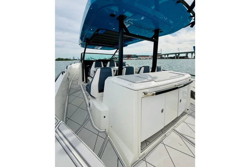 Out Of The Blue Yacht Photos Pics 2021 Axopar 37 Sun Top boat with sleek design and spacious deck on the water.