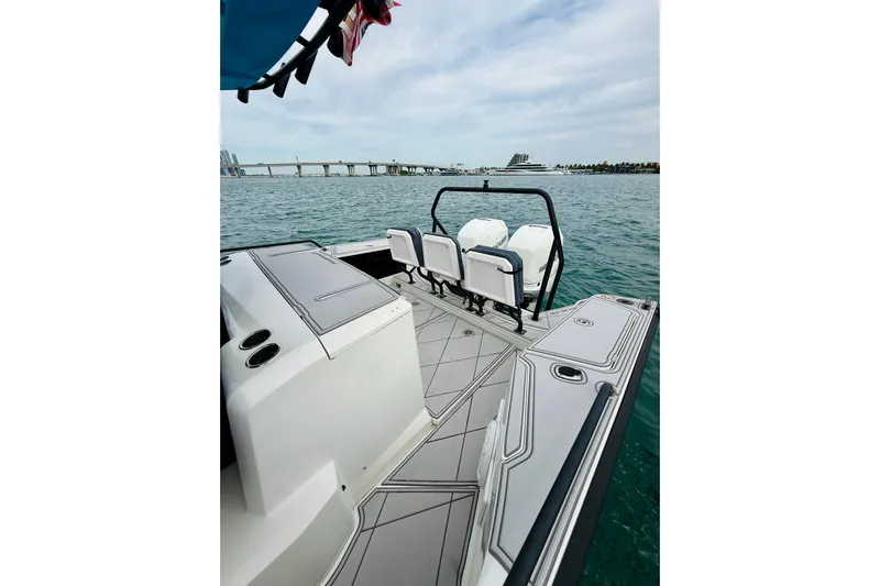 Out Of The Blue Yacht Photos Pics 2021 Axopar 37 Sun Top boat with sleek deck design on open water.