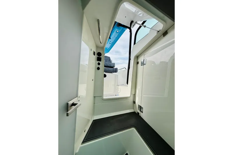 Out Of The Blue Yacht Photos Pics Interior view of 2021 Axopar 37 Sun Top boat, showcasing sleek design and modern features.