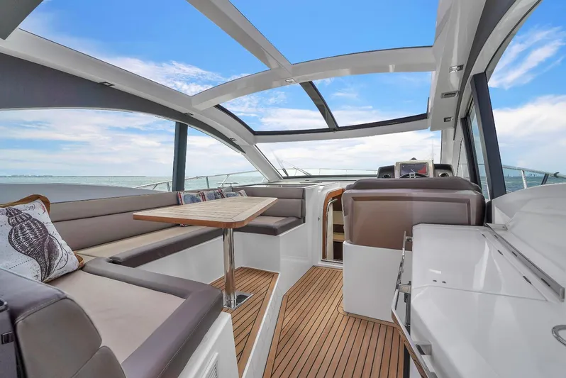  Yacht Photos Pics Interior of 2017 Galeon 445 HTS yacht with modern seating and panoramic windows.