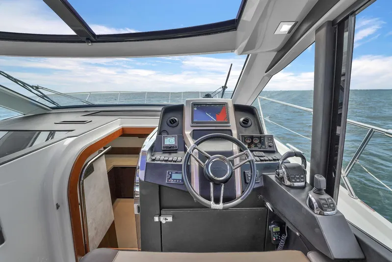  Yacht Photos Pics Helm station of 2017 Galeon 445 HTS yacht with modern navigation equipment.