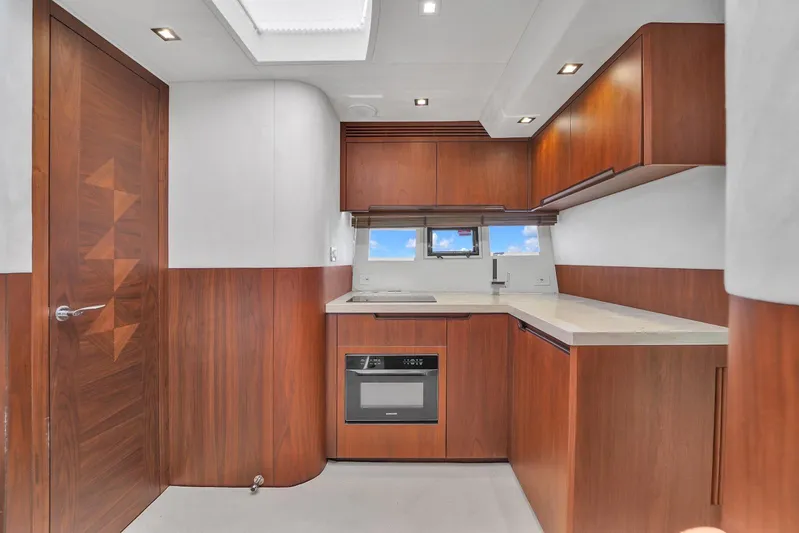  Yacht Photos Pics Modern kitchen interior of 2017 Galeon 445 HTS yacht with wooden cabinetry.