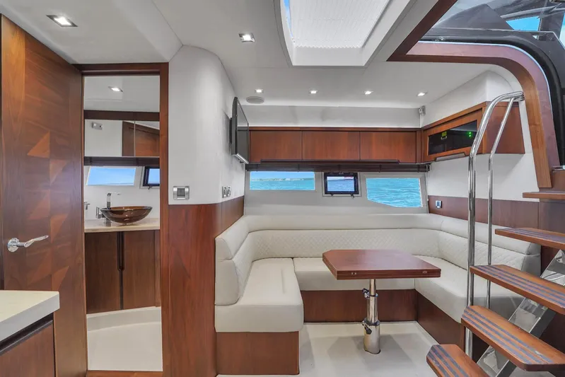  Yacht Photos Pics Luxurious interior of 2017 Galeon 445 HTS yacht with modern wood finishes.