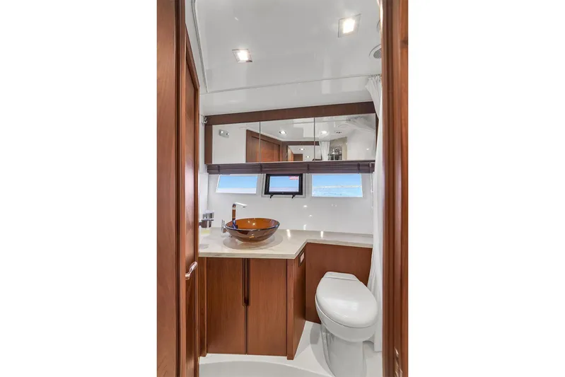  Yacht Photos Pics Luxurious bathroom in 2017 Galeon 445 HTS yacht with modern fixtures and ocean view.