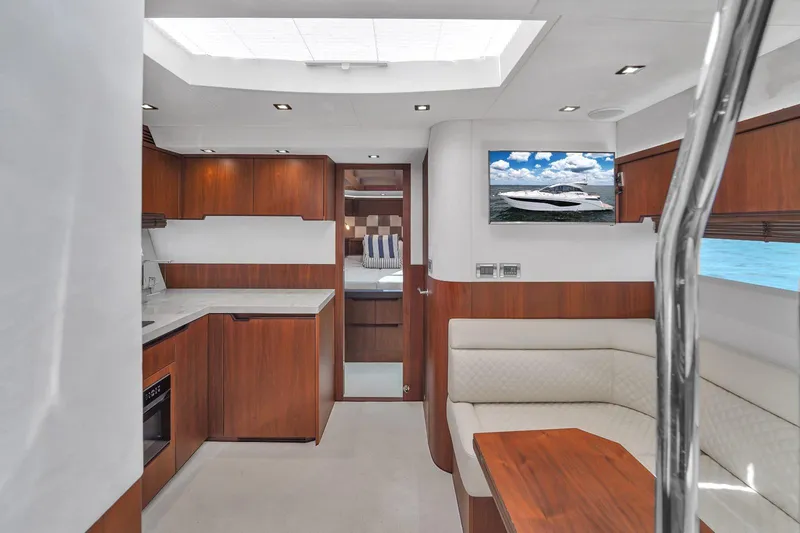  Yacht Photos Pics Interior of 2017 Galeon 445 HTS yacht with modern kitchen and seating area.