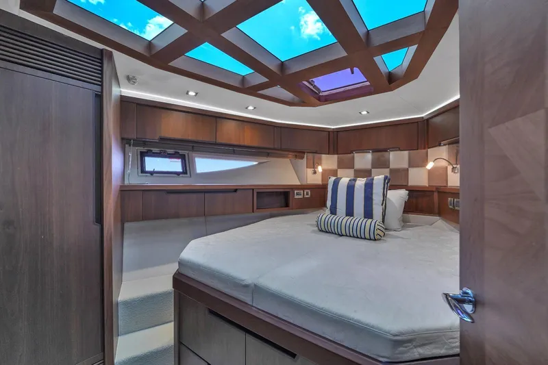  Yacht Photos Pics Luxurious bedroom interior of 2017 Galeon 445 HTS yacht with skylight and modern design.