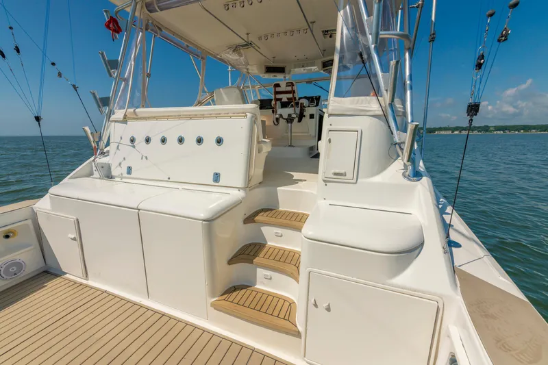 Alexa Corinne Yacht Photos Pics 1999 Ocean Yachts 48 Express boat deck with seating and ocean view.