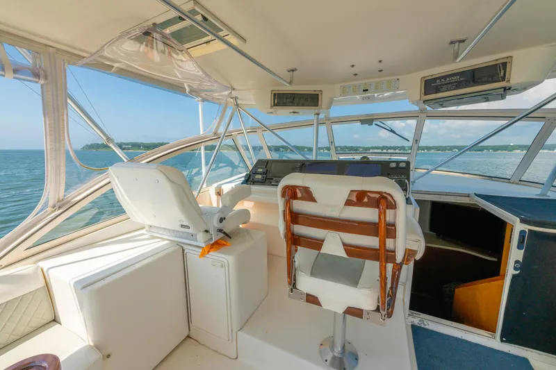 Alexa Corinne Yacht Photos Pics 1999 Ocean Yachts 48 Express helm with panoramic ocean view and comfortable seating.