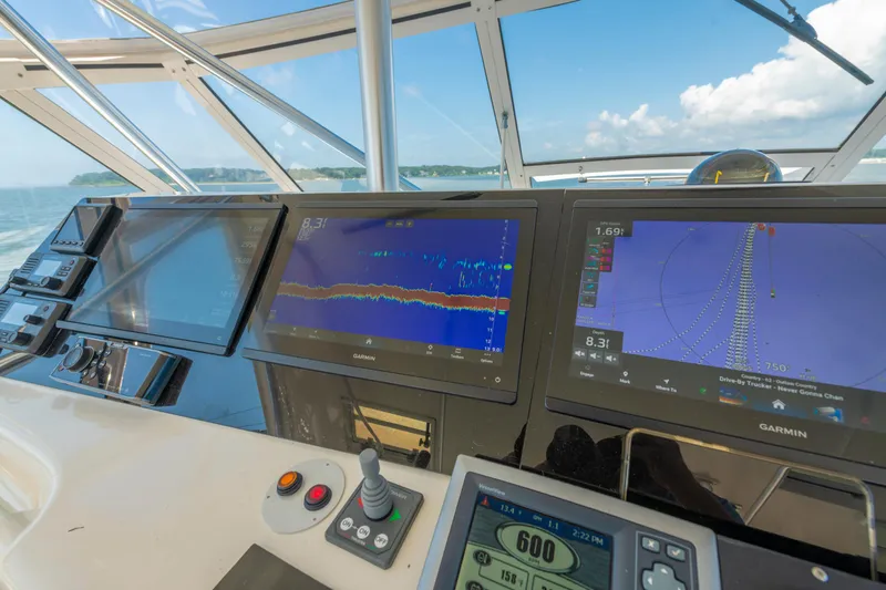 Alexa Corinne Yacht Photos Pics Cockpit of 1999 Ocean Yachts 48 Express with Garmin navigation displays and controls.