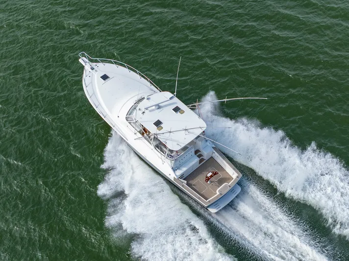 Alexa Corinne Yacht Photos Pics Aerial view of 1999 Ocean Yachts 48 Express cruising on open water.