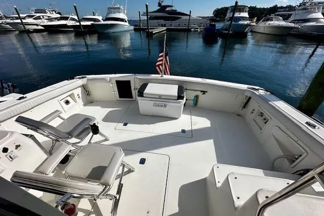  Yacht Photos Pics 2001 Silverton 42 Convertible yacht deck with seating, docked at marina with other boats.