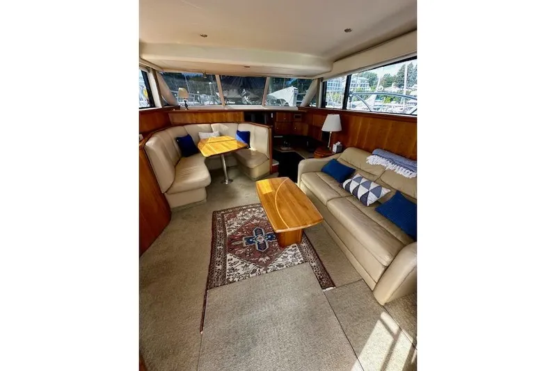  Yacht Photos Pics Luxurious interior of 2001 Silverton 42 Convertible yacht with plush seating and elegant decor.