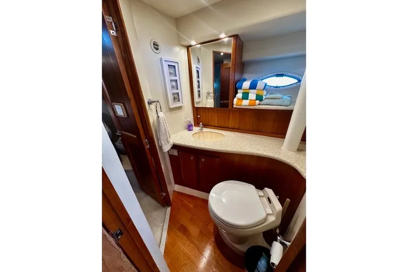  Yacht Photos Pics Luxurious bathroom in 2001 Silverton 42 Convertible yacht with modern amenities and elegant design.
