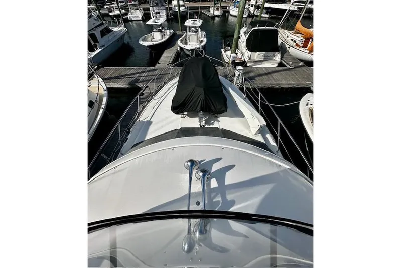  Yacht Photos Pics 2001 Silverton 42 Convertible yacht docked at marina, viewed from bow.