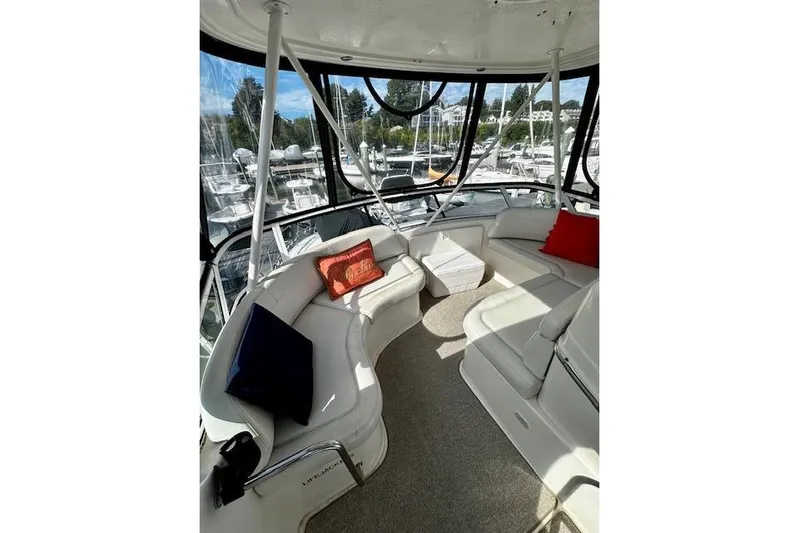  Yacht Photos Pics Luxurious interior of 2001 Silverton 42 Convertible yacht with plush seating and cushions.
