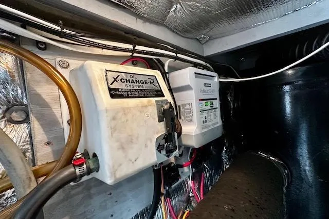  Yacht Photos Pics Engine room of 2001 Silverton 42 Convertible with oil changer system and wiring.