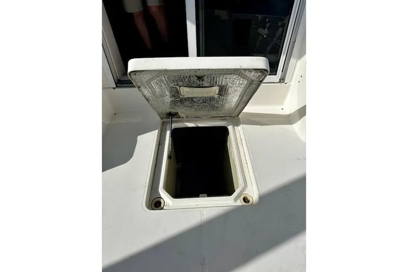  Yacht Photos Pics Open hatch on 2001 Silverton 42 Convertible boat deck, revealing storage compartment.