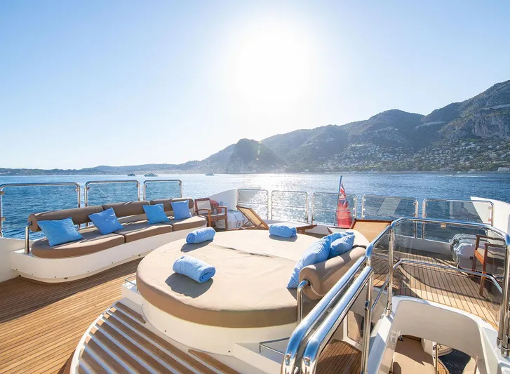 Grace Yacht Photos Pics Luxury deck of 2009 Astondoa 96 GLX yacht with sun loungers and ocean view.