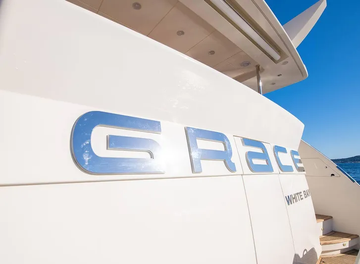 Grace Yacht Photos Pics Astondoa 96 GLX yacht, 2009 model, with "Grace" nameplate, docked under clear blue sky.