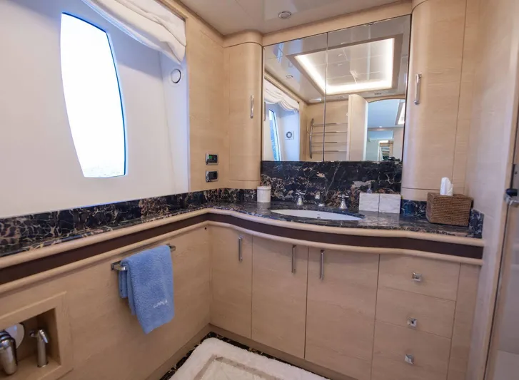 Grace Yacht Photos Pics Luxurious bathroom interior of 2009 Astondoa 96 GLX yacht with elegant wood cabinetry.