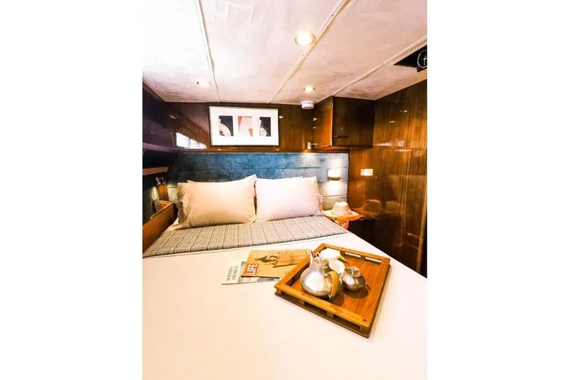 New School Yacht Photos Pics Luxurious cabin interior of 1966 Chris-Craft 57 Constellation yacht with cozy bed and decor.