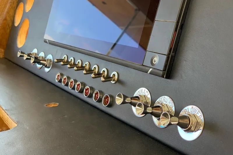 New School Yacht Photos Pics Control panel of 1966 Chris-Craft 57 Constellation with switches and buttons.