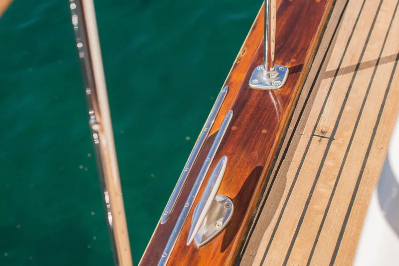 New School Yacht Photos Pics 1966 Chris-Craft Constellation boat deck with polished wood and metal fittings.